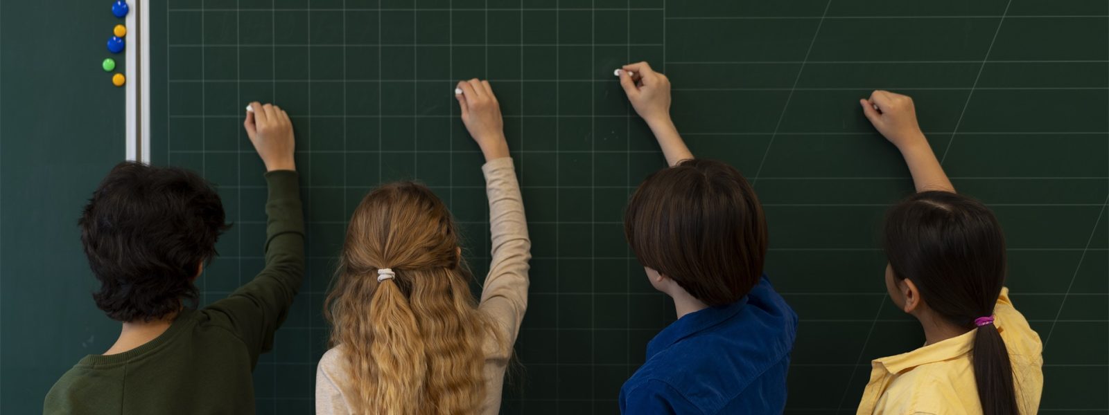 back-view-kids-writing-board